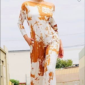 Off the shoulder , relax fit long sleeve jumpsuit with side pockets. Casual,